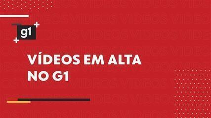 Posto de combustível com placa de preços reais, mostrando valores abaixo da montagem falsa